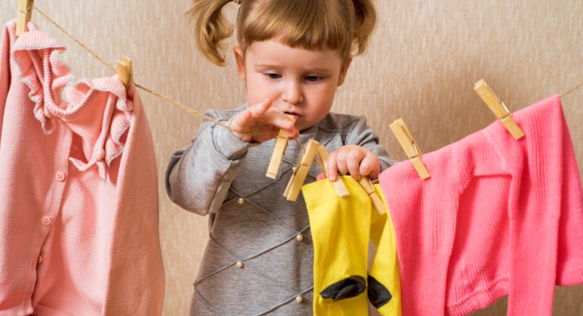 Funny,Girl,With,Clothespin,And,The,Clothesline.,Baby,Pink,Clothes